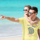 Dad on a beach in a yellow shirt with a brain-shaped QR code design and the text “Awesome Dad’s Brain – Now Scannable,” daughter hugging him from behind.