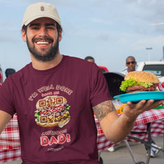 Dad wearing a maroon t-shirt with a QR code burger design and the phrase “I'm Well Done – Scan Me, Awesome Dad,” holding a burger and smiling at a BBQ.